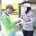 Bagikan Paket Ikan, Polisi di Apresiasi Masyarakat